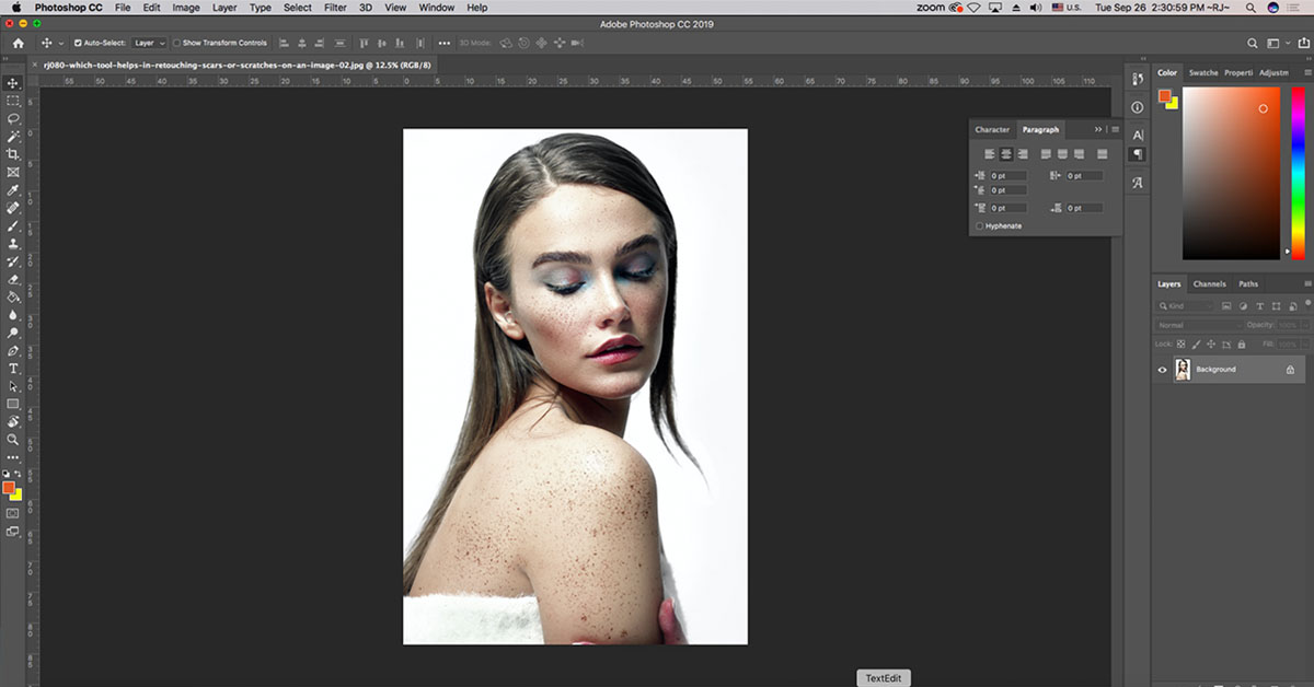 Which Tool Helps in Retouching Scars or Scratches on an Image?
